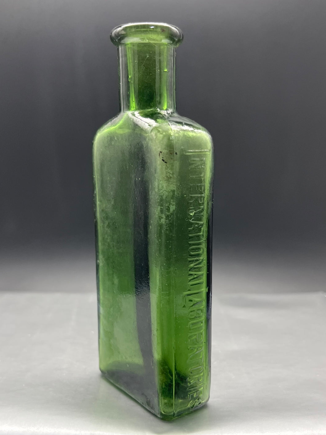 International Laboratories Small Green Poison Bottle